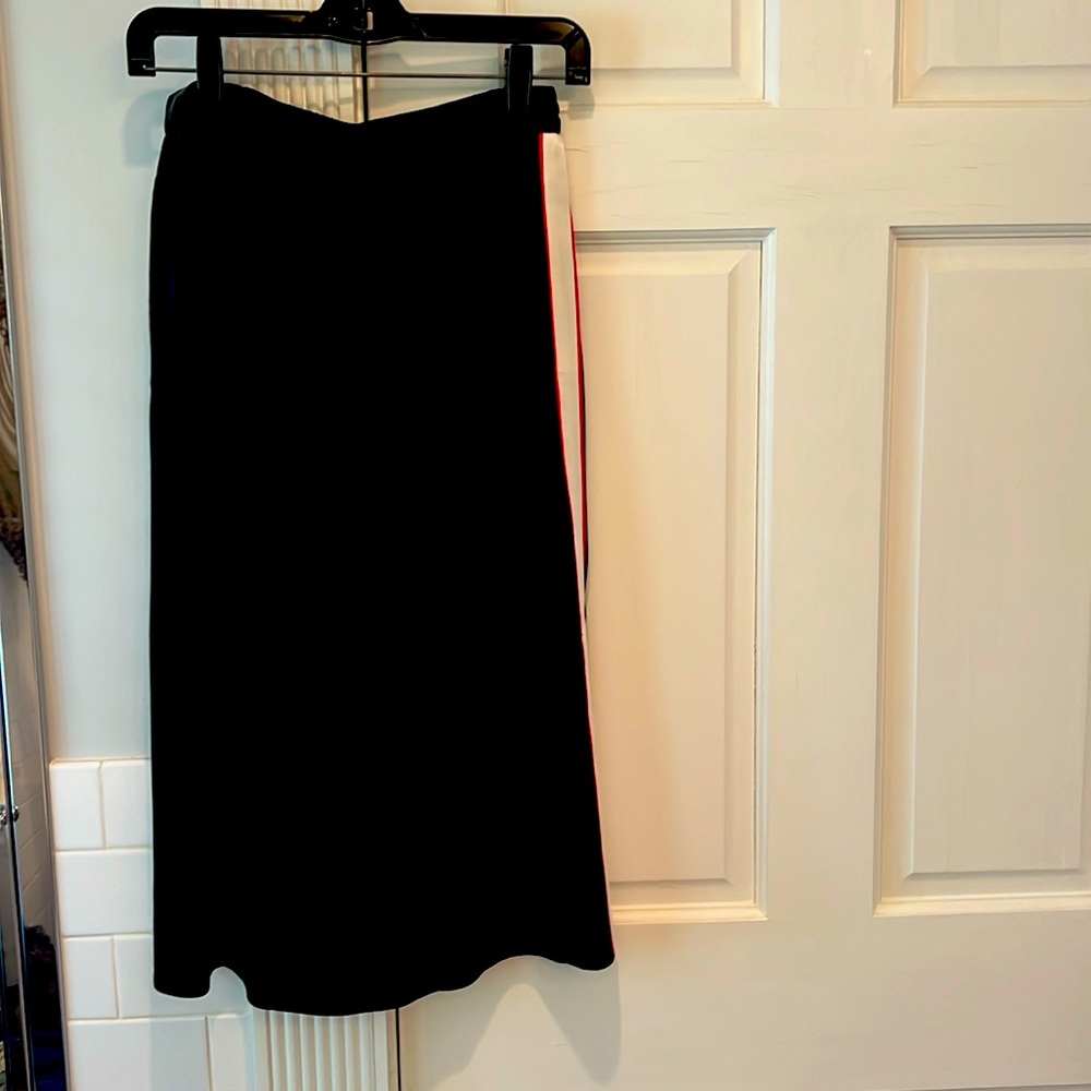 Rag and Bone size 2 black skirt with white/red side stripes.